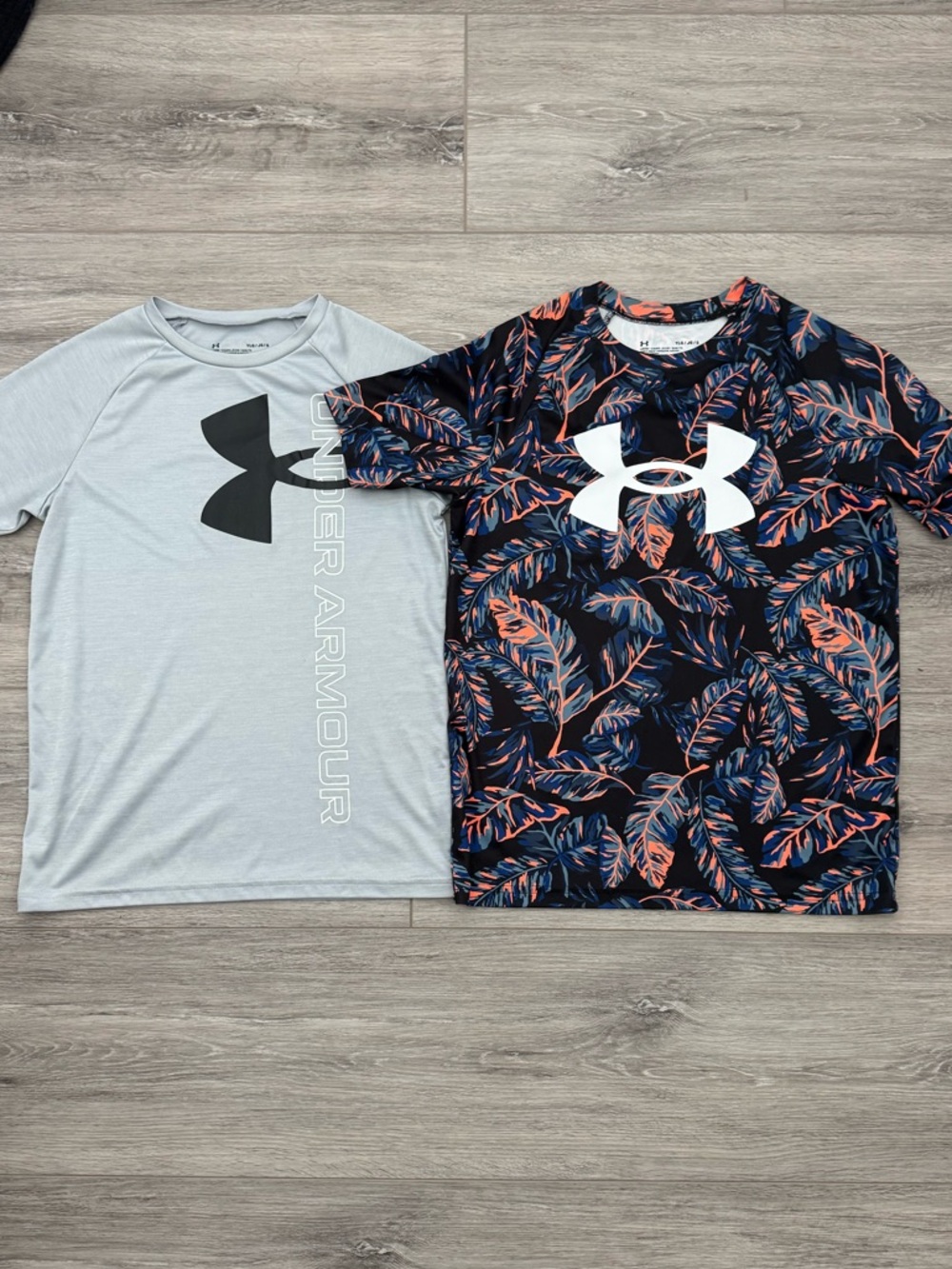 Two boys Under Armour tees - performance ‘loose’ fit.
